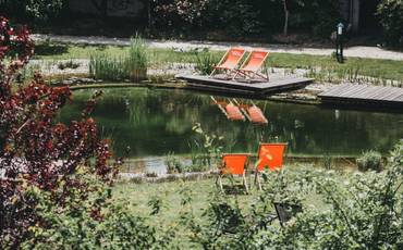 Natural bathing pond in the Paradiesgart'l at the Wellnesshotel Molzbachhof