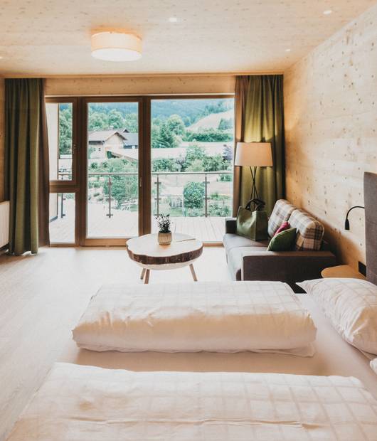 Room Baumgeflüster at the Holzhotel Molzbachhof