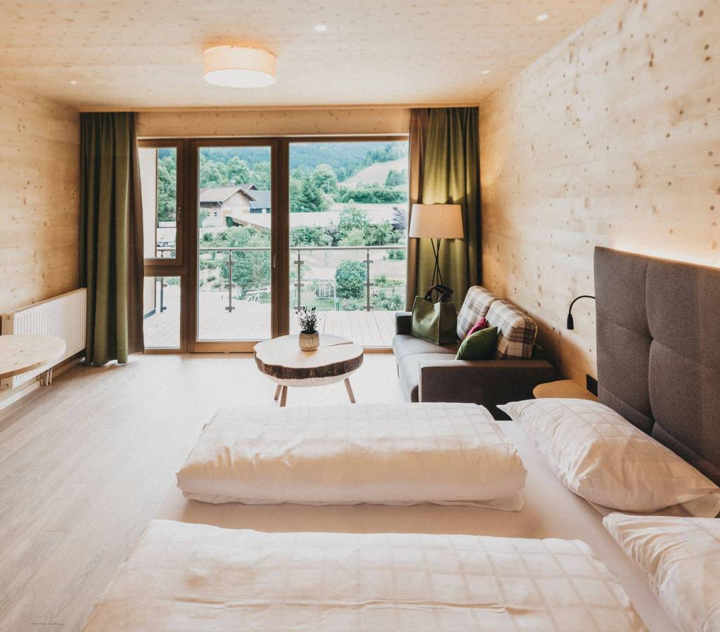 Room Baumgeflüster at the Holzhotel Molzbachhof